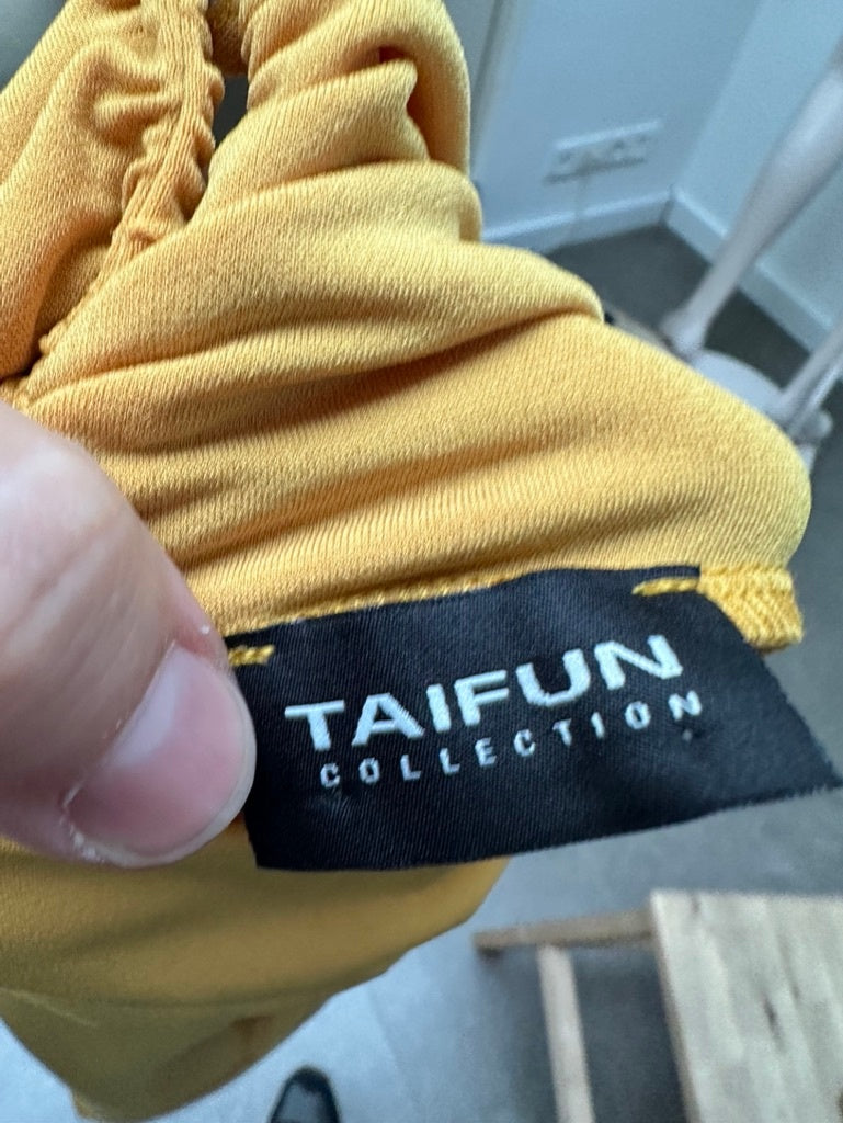 Taifun mouwloze col maat 40 geel