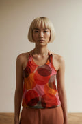 Close-up of the model wearing WAX Tank top maat 40 rood