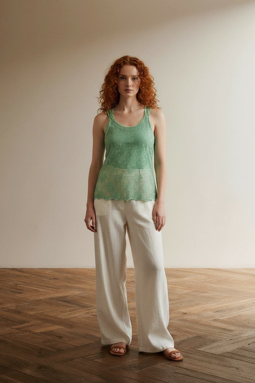 Full body view of the model wearing Twin-Set Simona Barbieri mintgroene kanten top maat L – made in Italy